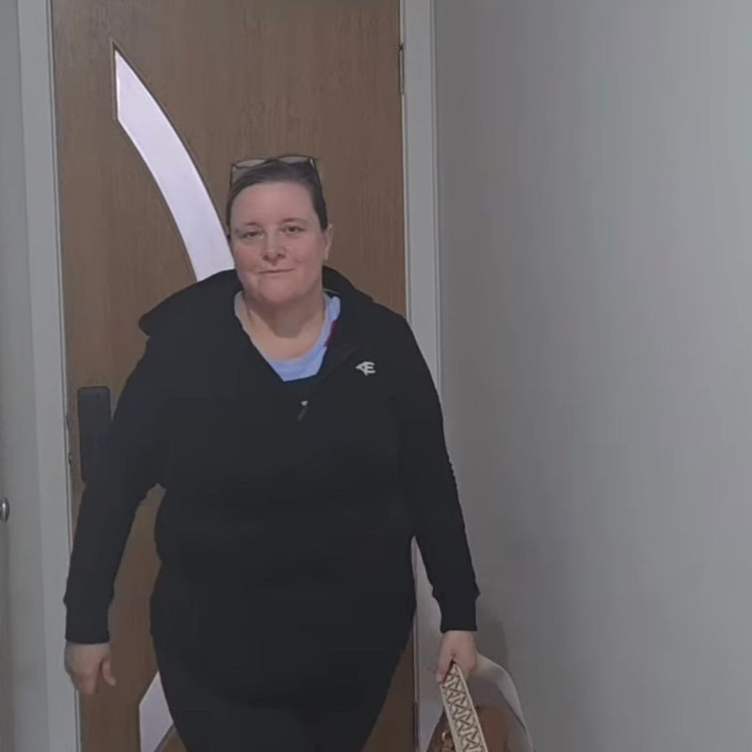 woman wearing black hood jacket and leggings with pockets