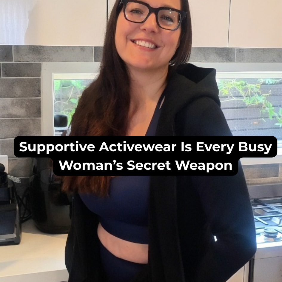 an imager of a women dressed in activewear smiling standing in front of kitchen bench