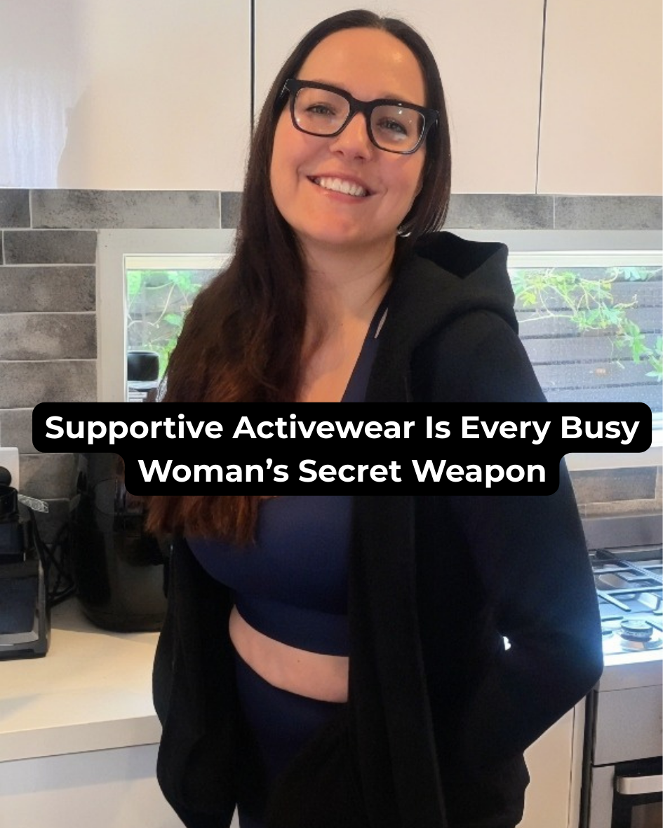 an imager of a women dressed in activewear smiling standing in front of kitchen bench